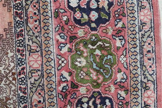 A Persian pattern rose ground cotton and silk rug 298 x 215cm